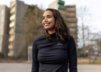 Young Indian woman exuding confidence and positivity, representing the top 10 skills to develop in your early 20s for long-term success.