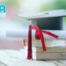 Graduate hat, rolled degree paper with ribbon, and NBA logo representing the impact of non-NBA accredited CSE courses on overseas job prospects